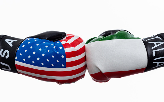 USA flag and Italian flag on boxing gloves.