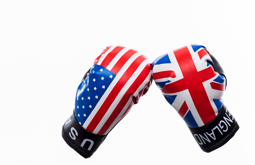 USA flag and UK flag on boxing gloves.
