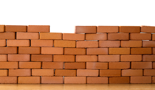 Small brick wall on white background.