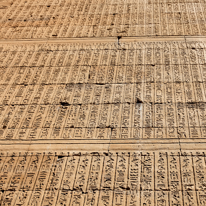Wall of hieroglyphics at the Temple of Edfu in Edfu, Egypt.