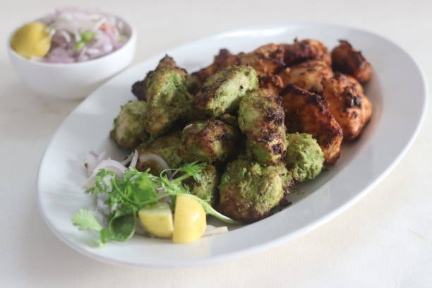 istock Green and red chicken kababs. Boneless chicken cubes marinated and air fried 1388024224