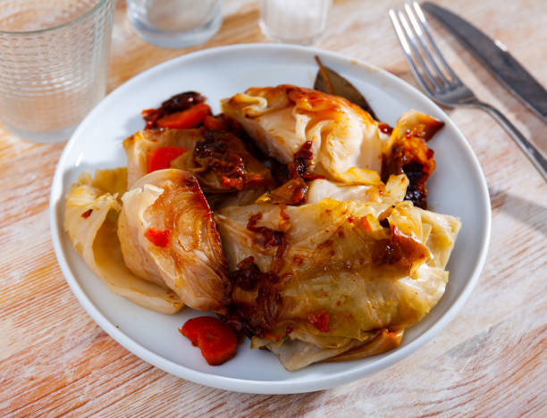 istock Portion of stewed cabbage on wooden table 1388024262