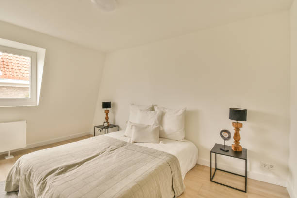 istock Spacious white bedroom in a minimalist style 1388024515
