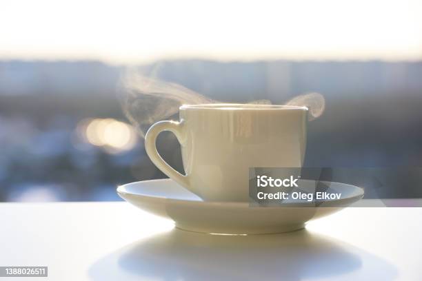 https://media.istockphoto.com/id/1388026511/photo/hot-coffee-or-tea-cup-with-steam-smoke-on-shining-sun-background.jpg?s=612x612&w=is&k=20&c=9fdj6JF7lfRXUt46O4o3PprRwvSKrbLs520peJKNj2k=