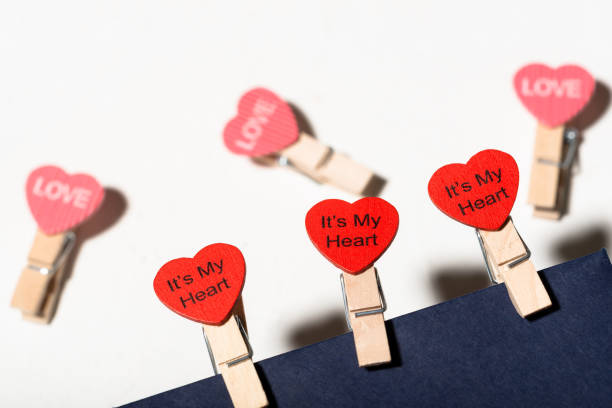 istock Clothespins with hearts on a blue envelope. Love letter concept. Valentine's day concept. Declaration of love. 1388027794