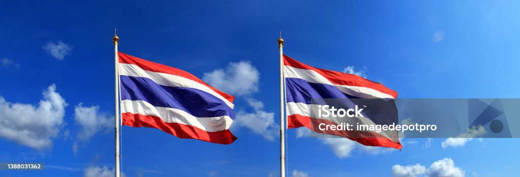 Close up two Thailand flag at flagpole over sunny blue sky Two Thailand flag at flagpole Thai Flag Stock Photo