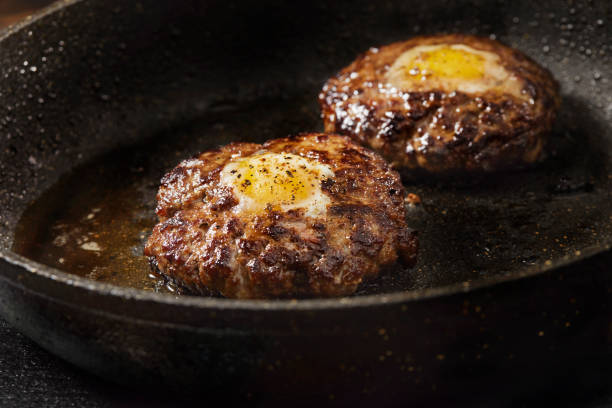 Frying Egg in a Hole Breakfast Burgers