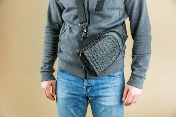 istock men's leather sling bag is on person 1388033657