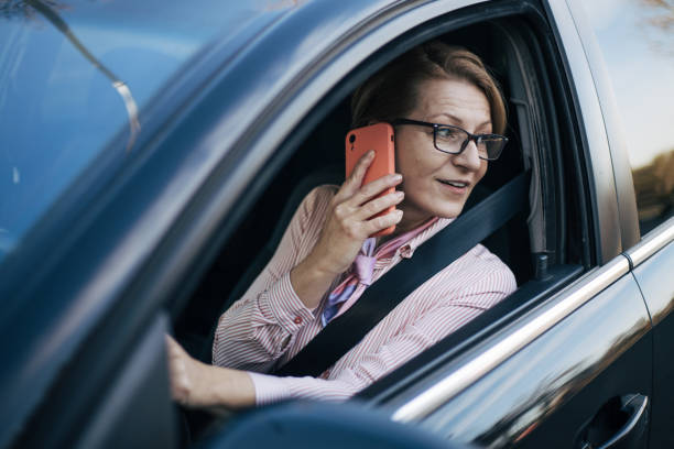 istock Mature woman in a car. 1388035230