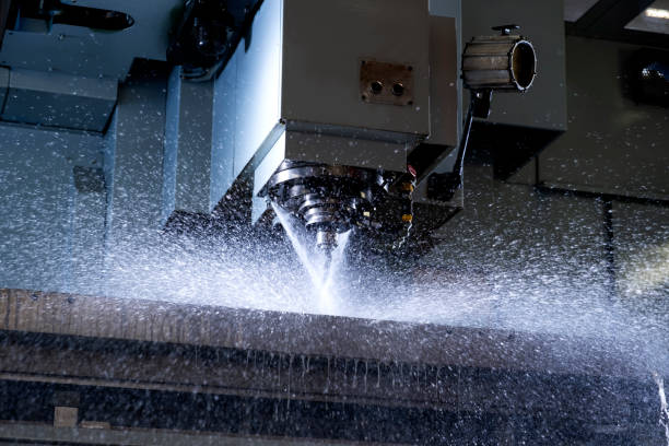 istock Close-up of industrial drill being sprayed with water. 1388036635