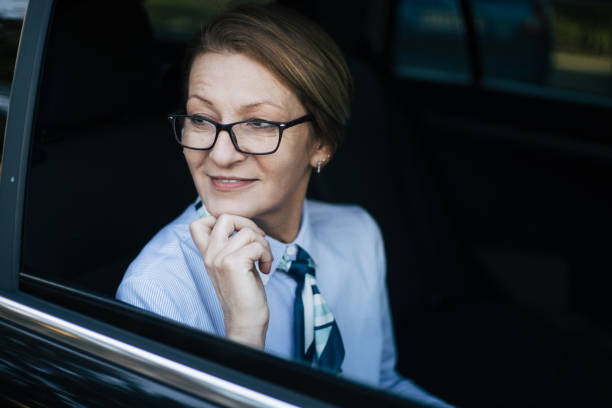 istock Mature woman driving a car. 1388036681