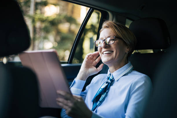 istock Mature woman driving a car. 1388036819