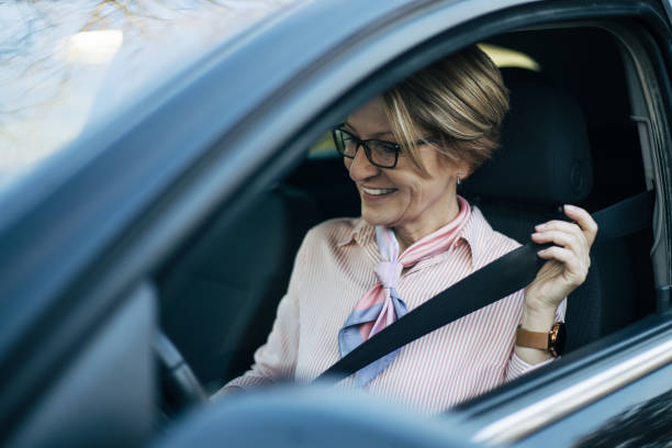 istock Mature woman in a car. 1388036865