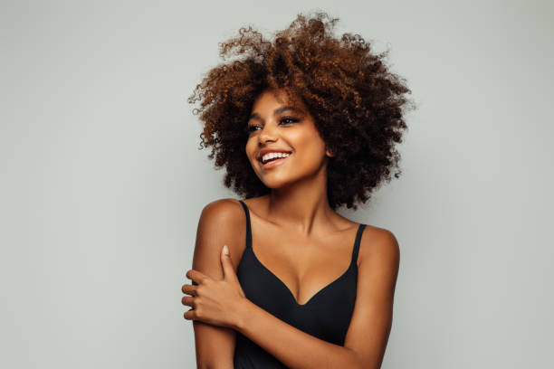 Beautiful emotional afro woman with perfect make-up stock photo