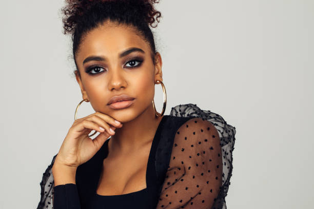 istock Beautiful afro woman with perfect make-up 1388037150