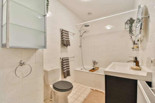istock Cozy bathroom with toilet tub and ceramic sink 1388040639