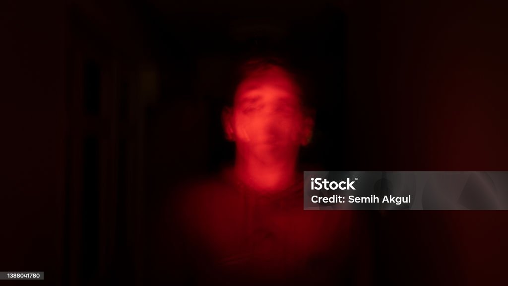 Horror Concept Spooky Young Adult Man Silhouette In the Dark Devil Stock Photo