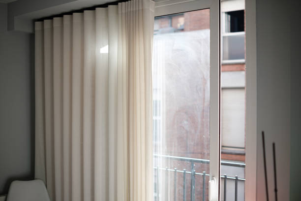istock White curtains on a dirty window indoor house scene 1388041842