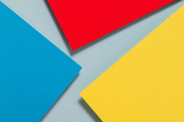istock Abstract color papers geometry flat lay composition background with blue, yellow and red color tones 1388042228