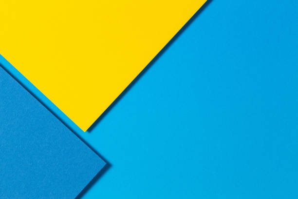 istock Abstract color papers geometry flat lay composition background with yellow and blue tones 1388042242