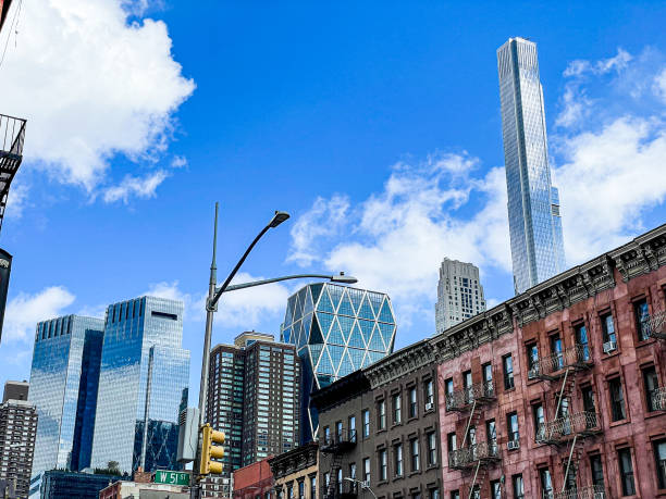 Horizontal view of the city line, showing the Time Warner Center, the Hearst Tower, and 1717 Broadway. Viewed from Hell's Kitchen on the West Side of Manhattan. New York, NY - USA - Mar 26, 2022: Horizontal view of the city line, showing the Time Warner Center, the Hearst Tower, and 1717 Broadway. Viewed from Hell's Kitchen on the West Side of Manhattan. logan west stock pictures, royalty-free photos & images