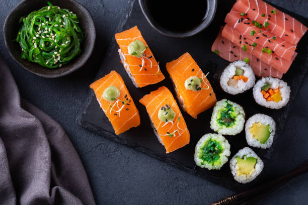 Vegan Sushi, Sashimi and Maki Rolls with Plant based seafood Vegan Nigiri Sushi, Sashimi, Maki Rolls with Plant based seafood salmon and tuna. Food to reduce carbon footprint. View from above, flat lay sushi stock pictures, royalty-free photos & images