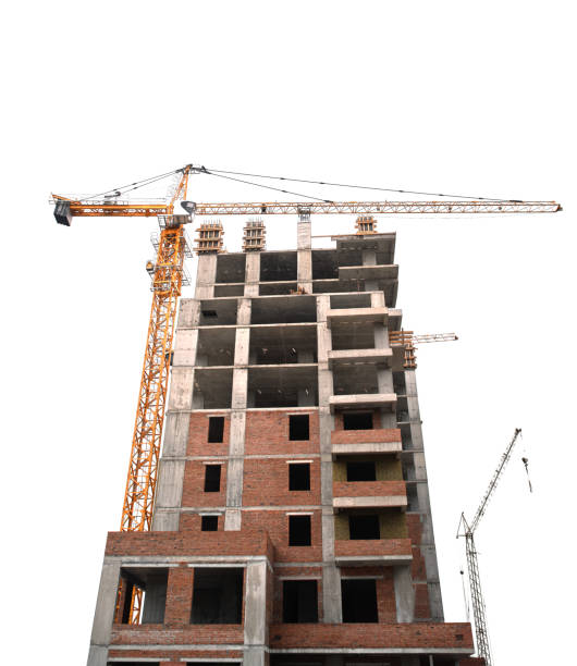 istock Construction yellow crane and frame of new multi-storey building on a white background 1388044637