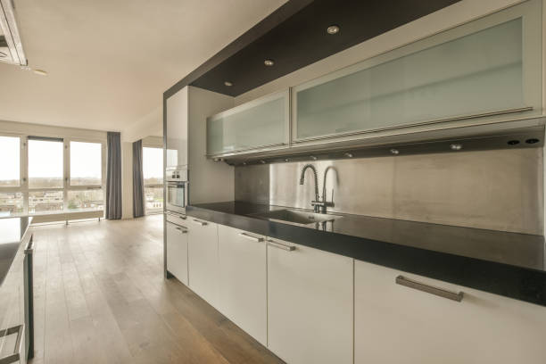 istock Open-style kitchen with white furniture 1388047916