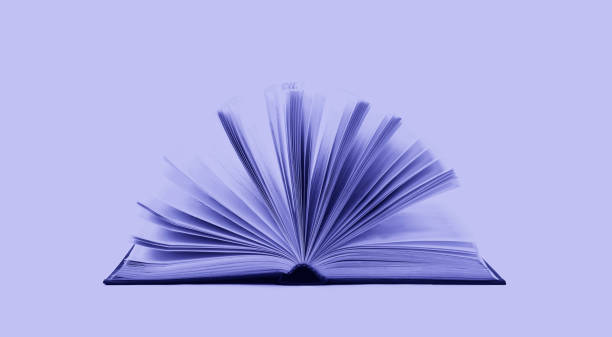 open book toned in trendy violet Very Peri color of the Year 2022 stock photo