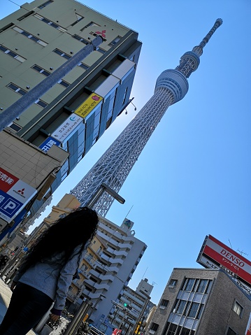 April 3, 2019 - Tokyo, Japan: tourist woman at the bottom of Tokyo sky-tree tower
