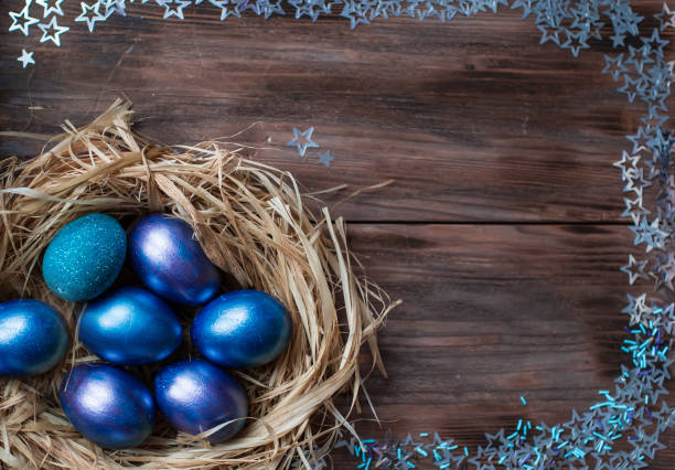 istock Blue Easter eggs in a nest on a wooden background. Easter card with a place to copy the text. The concept of bright Easter. 1388054536