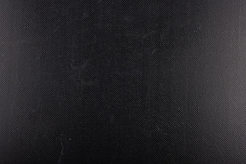 black rough plastic surface with regular artificial pimply bumps - full frame background and texture