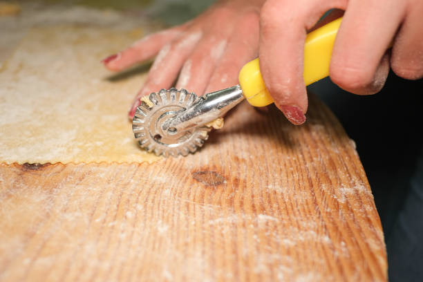 istock Woman hands while preparing sweets pastry in kitchen,homemade food,lockdown 1388057749