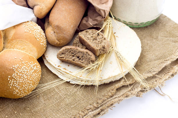 Bread, baguettes and sweet pastries on a white background.