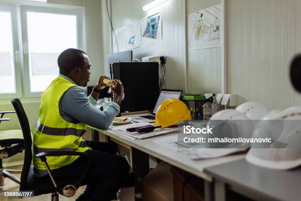 Lunch Break In The Office Stock Photo - Download Image Now - Construction Site, Construction Industry, Taking A Break