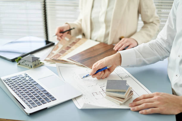 istock Asian architect designing a house 1388066923