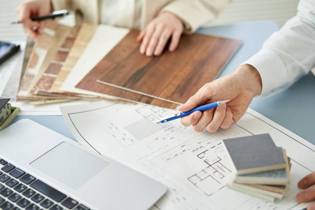 Asian architect designing a house Asian architect designing a house home improvement stock pictures, royalty-free photos & images