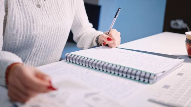 istock Young woman doing her home finances. 1388068031