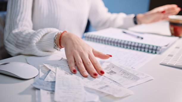 istock Young woman doing her home finances. 1388068033