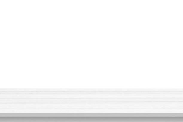 istock Empty white wooden table top isolated on white background 1388068085