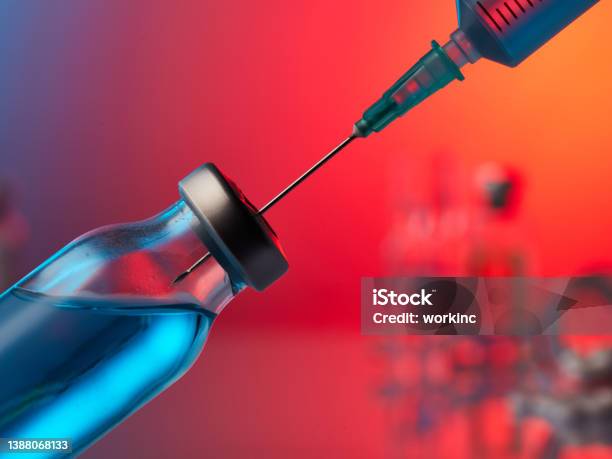 Needle Entering A Vial Of Covid19 Vaccine Stock Photo - Download Image Now - Syringe, Medicine, Healthcare And Medicine