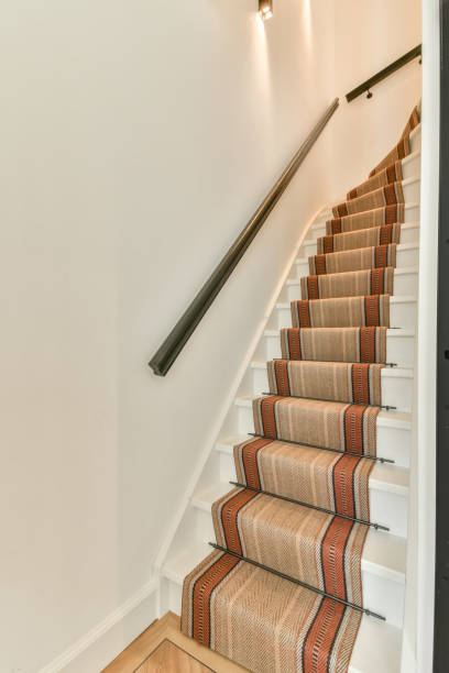 istock A staircase with a carpet laid on the steps 1388072424