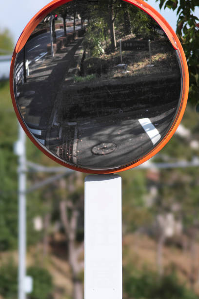 istock A convex traffic mirror at a road curve 1388077349