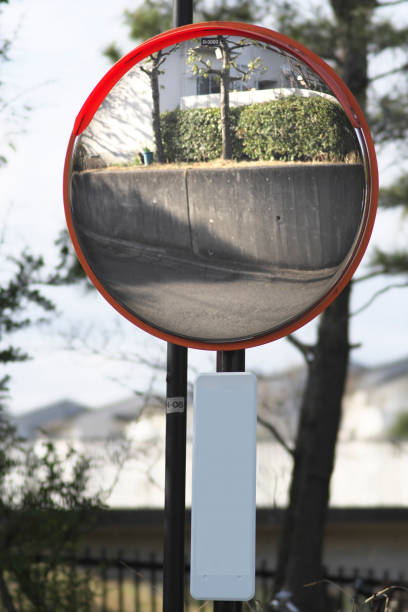 istock A convex traffic mirror at a road curve 1388077351