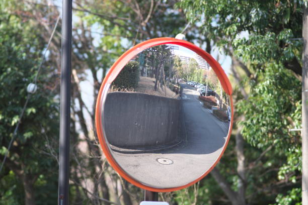 istock A convex traffic mirror at a road curve 1388077352