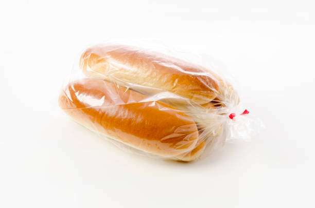 istock Hot dog bun in plastic bag on white background 1388081484