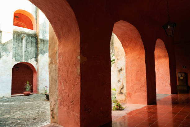 Repeated arched openings in an old weathered building in the Yucatan, Valladolid, Mexico
