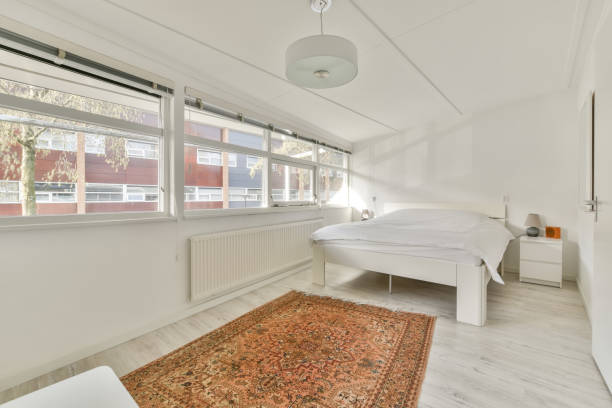 istock A small bedroom with a double bed in white 1388087656