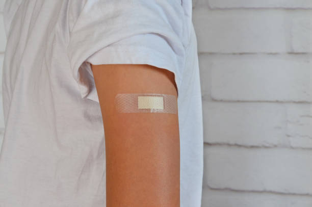 istock bandage on the hand after vactination 1388088443