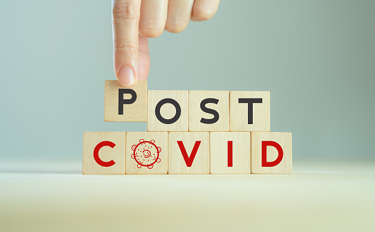 Post covid concept. Hope and the end. Long covid; long-term effects of coronavirus. Chronic fatigue, feeling tired easily. Medical, treatment long covid symstoms, recovery tips.
Wooden cube blocks.